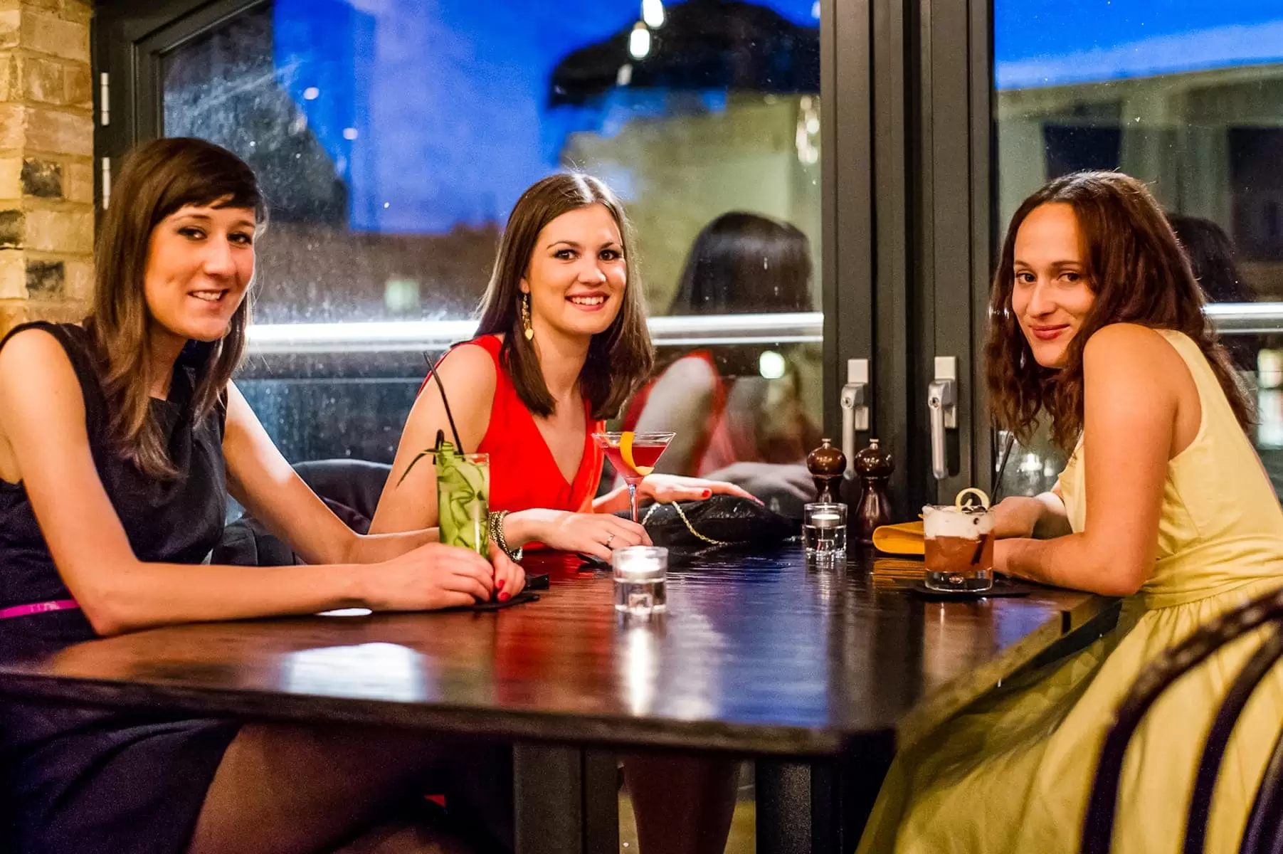 group of friends having cocktails