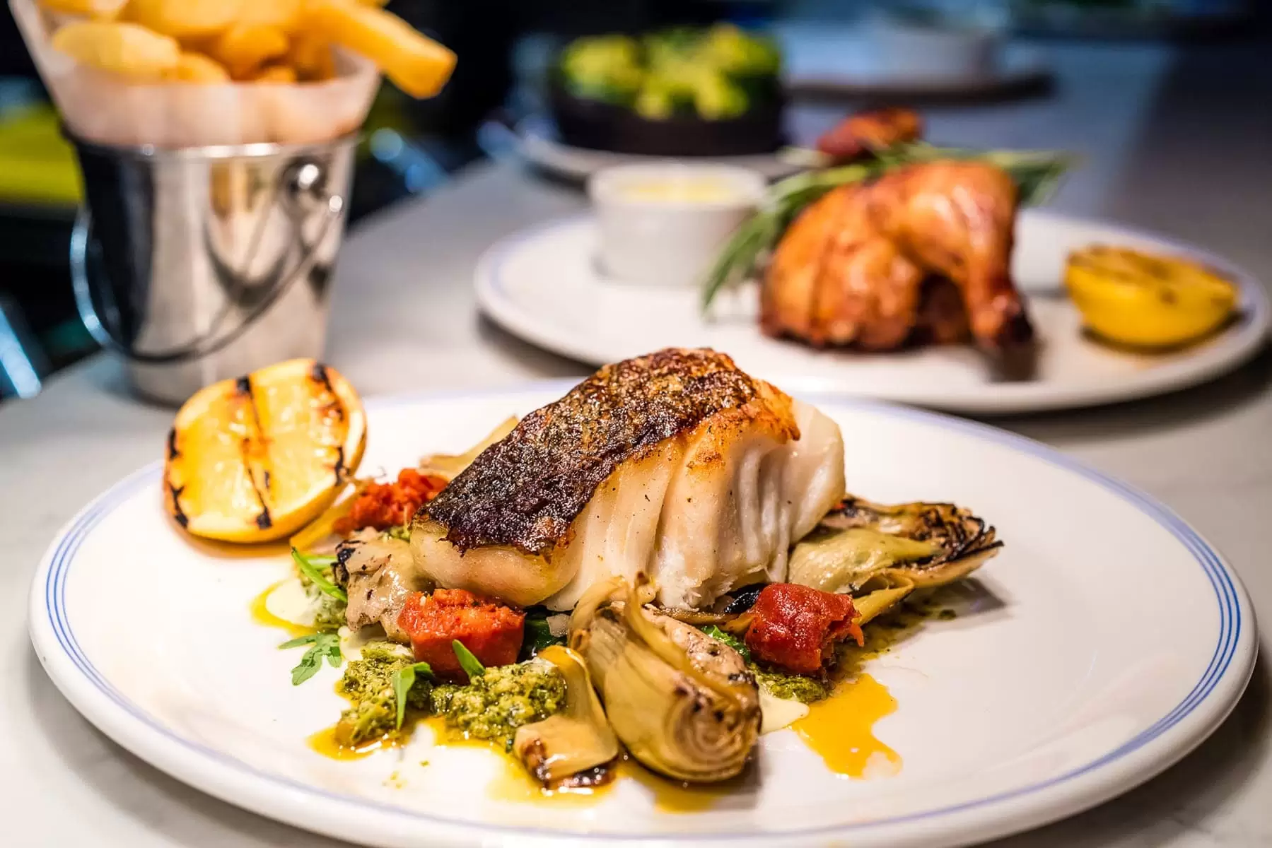 fish dinner with artichoke and pesto