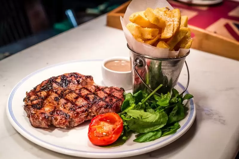steak dinner with chips