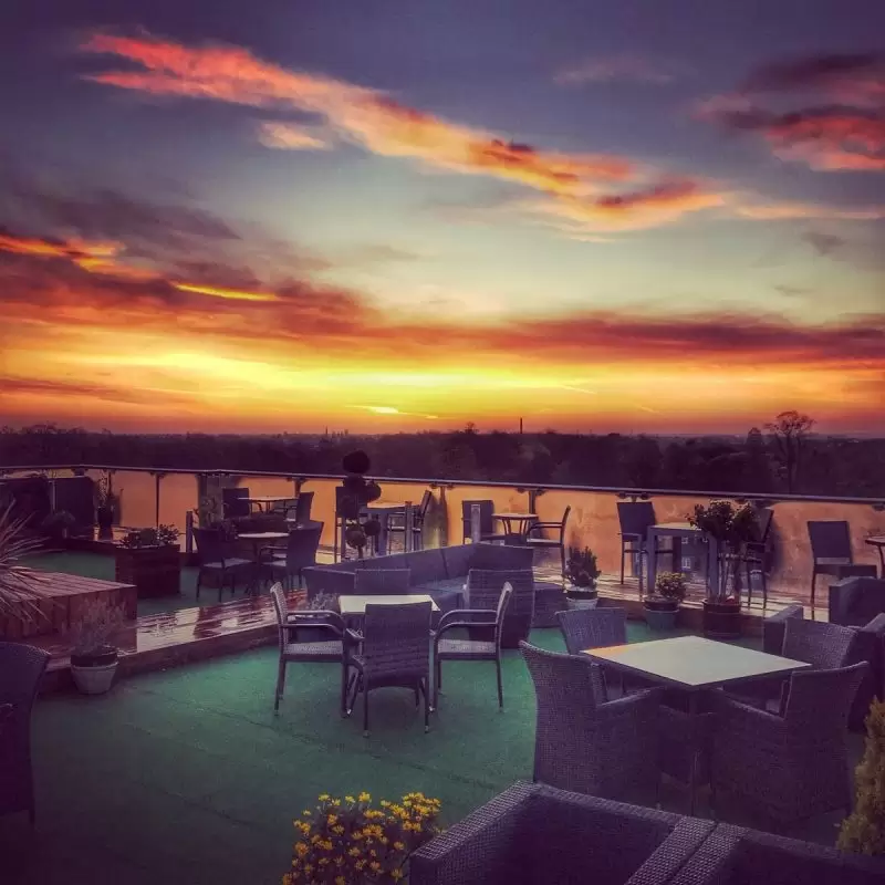 Sunset on a rooftop bar at The Varsity Cambridge