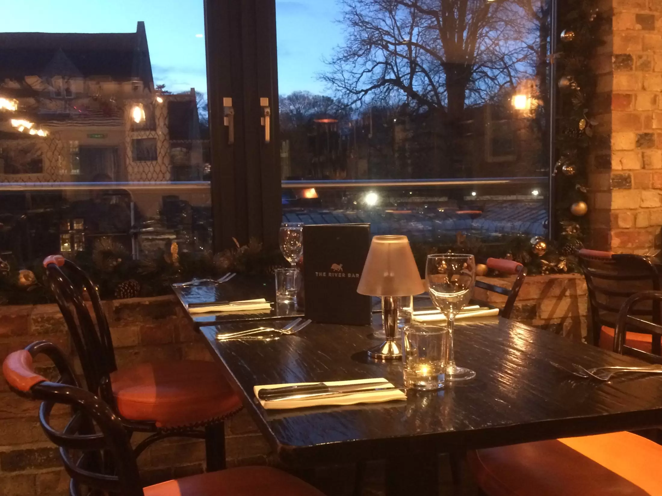 River Bar restaurant table set for dinner service