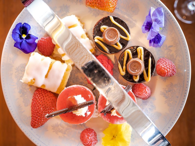 plate of sweet treats, rolo chocolates, strawberries, cakes and raspberries