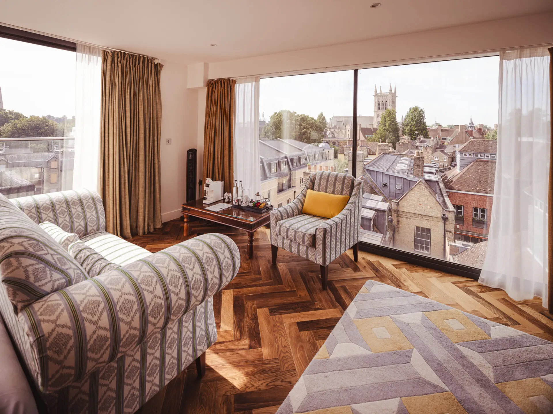 sofa and chair in superior room with yellow accents