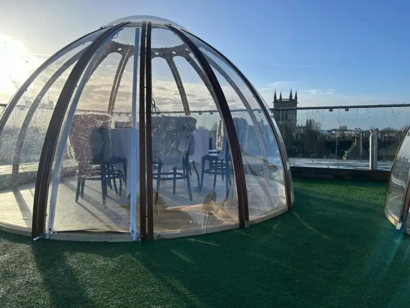 dome on rooftop with cambridge cathedral in the background