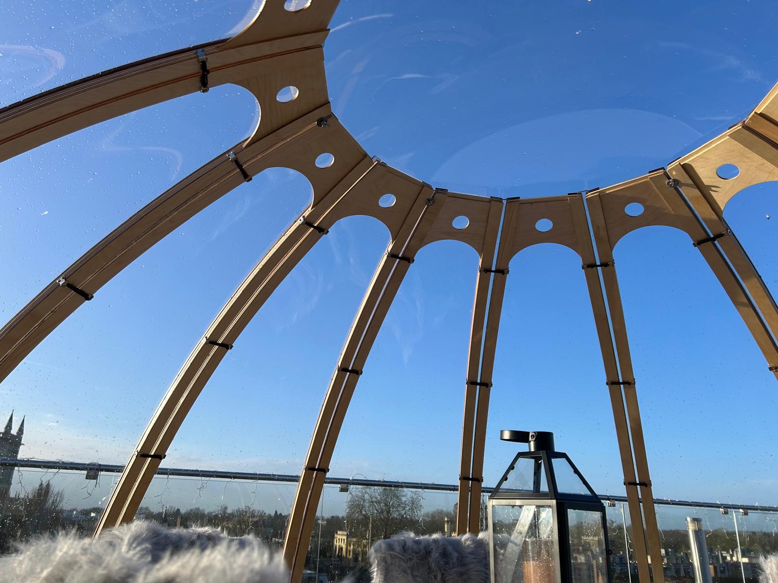 dome on top of rooftop with blue sky and view of cambridge